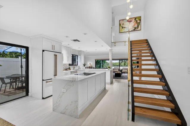 a living room with a sink and a mirror
