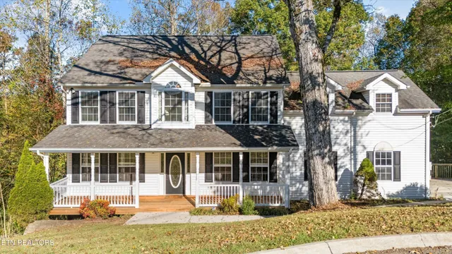a front view of a house with a yard table and chairs