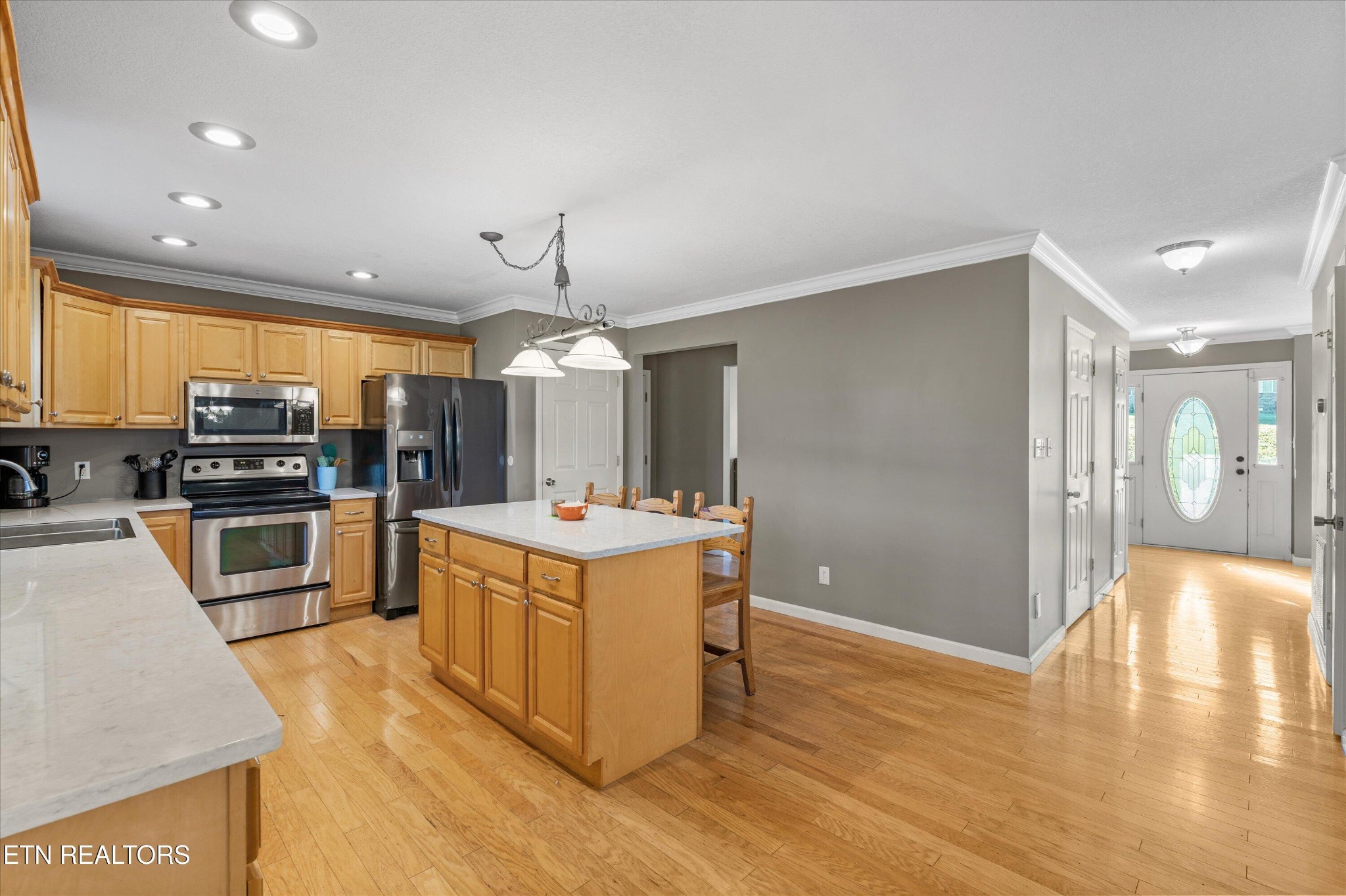 151 Huntington Lane Heiskell, TN 37754 - Photo 12 of 40 a kitchen with stainless steel appliances granite countertop a sink a stove and a refrigerator