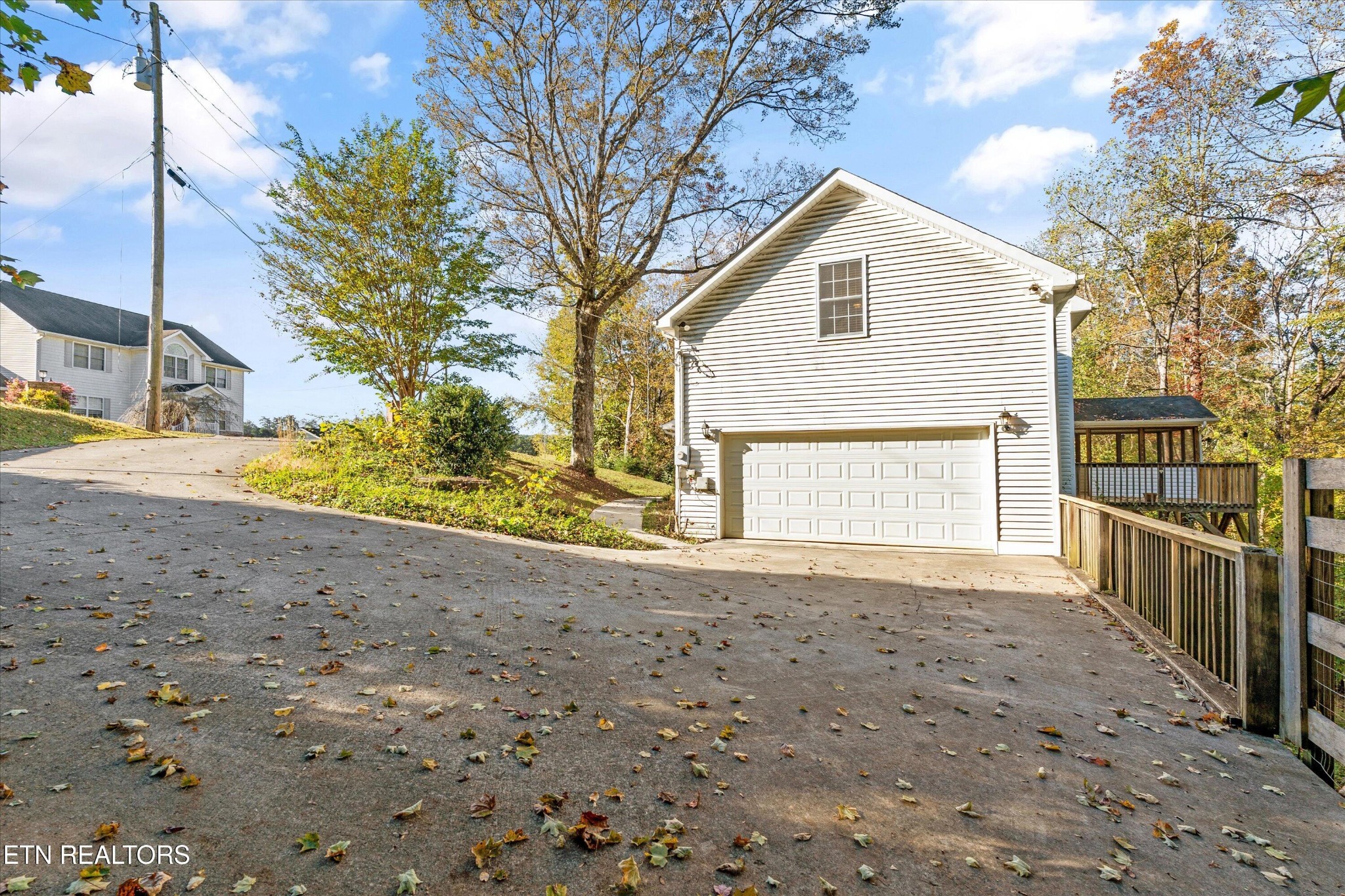151 Huntington Lane Heiskell, TN 37754 - Photo 30 of 40 a front view of a house with a yard and garage