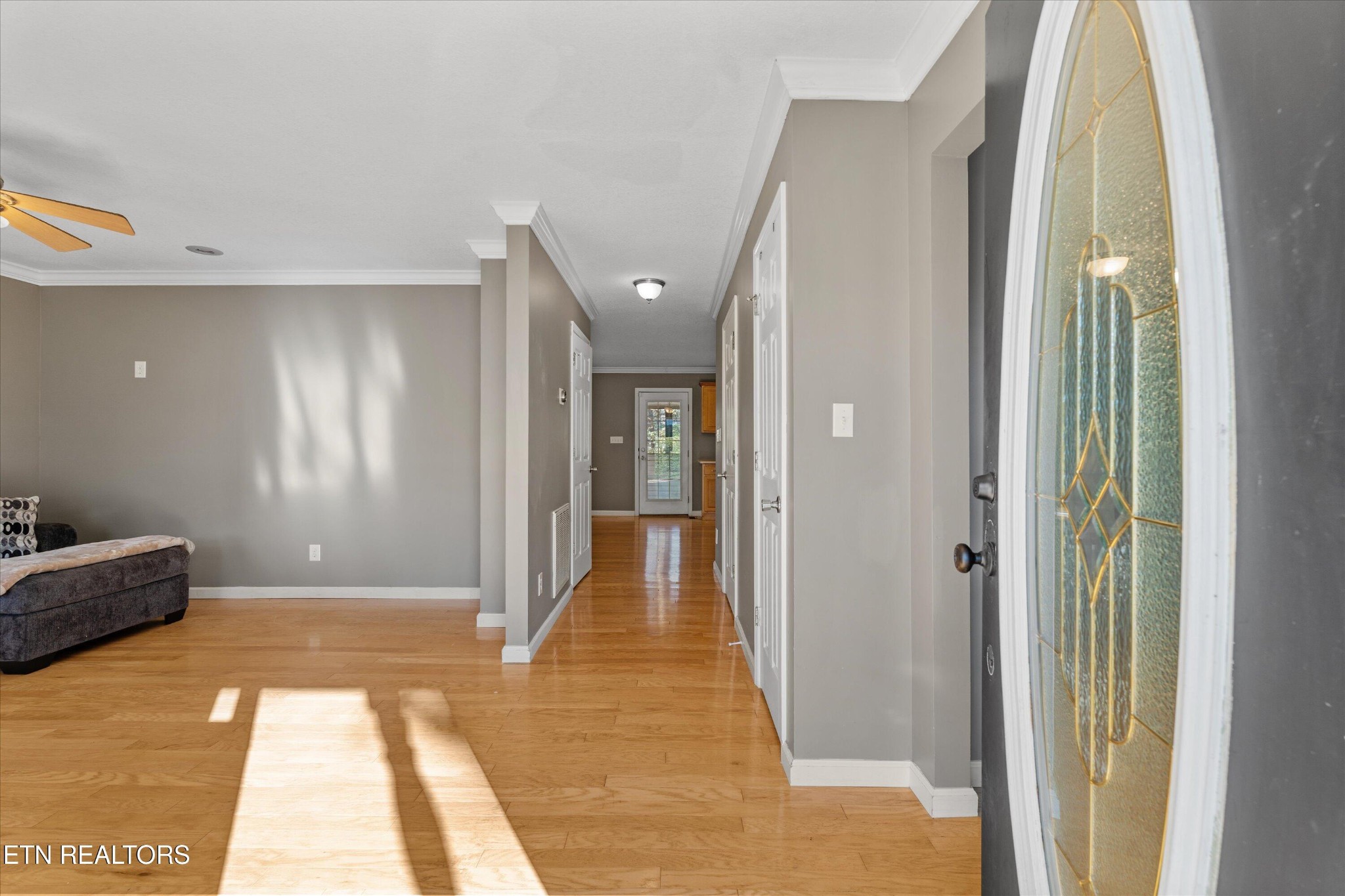 151 Huntington Lane Heiskell, TN 37754 - Photo 5 of 40 a view of a hallway with wooden floor and a bathroom