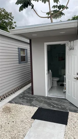 a view of a house with a door and chair