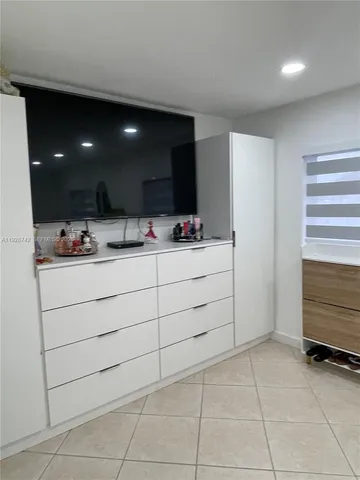 a bathroom with a double vanity sink mirror and shower