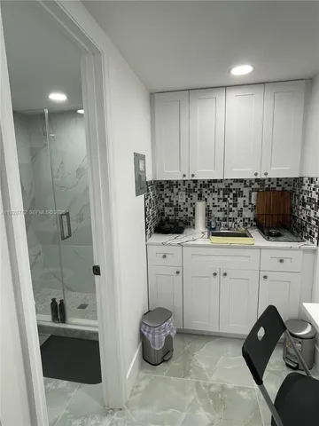 a close view of sink and cabinets