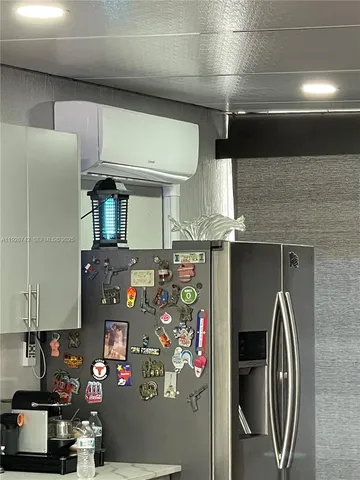 a view of living room with furniture and a fireplace