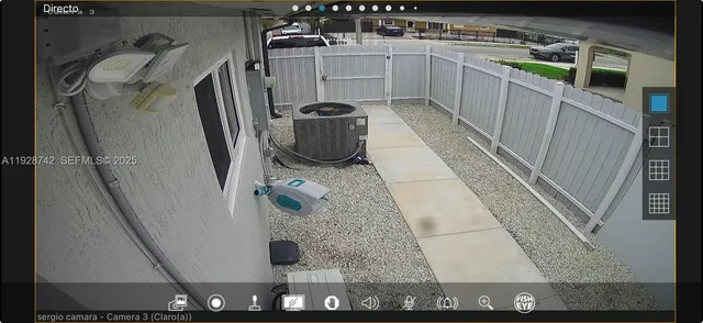 a kitchen with stainless steel appliances granite countertop a refrigerator dining table and chairs