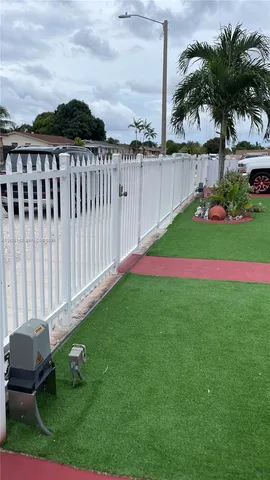 a garden with trees in front of it