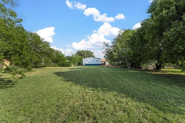 a view of a golf course with a lake view