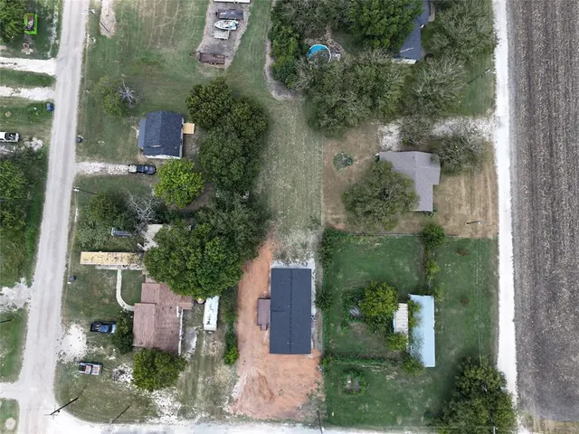 an aerial view of a house with outdoor space