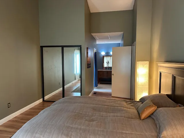 a bathroom with a tub and a mirror