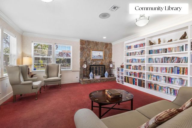 a room with furniture and a book shelf