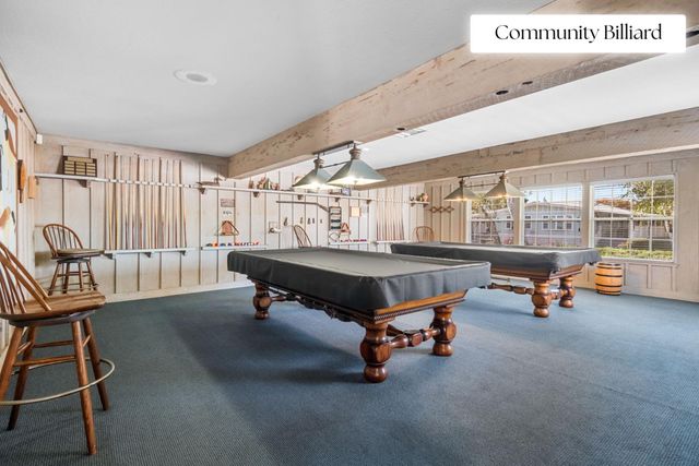 a room with gym equipment and windows