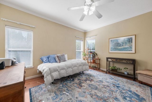 a bedroom with a bed and a couch