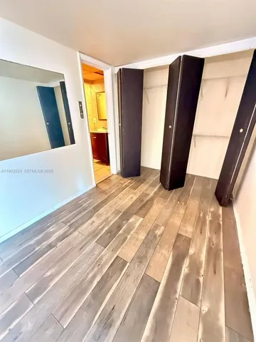 a view of an empty room with a fireplace