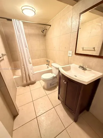 a bathroom with a sink a toilet and a bathtub
