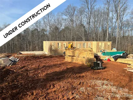 a view of outdoor space with wooden fence