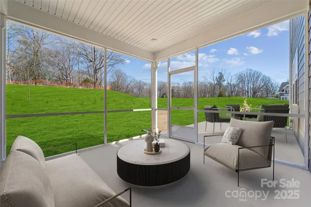 a view of a patio with couches chairs and a yard