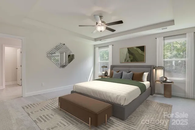 a bedroom with a large bed and a window