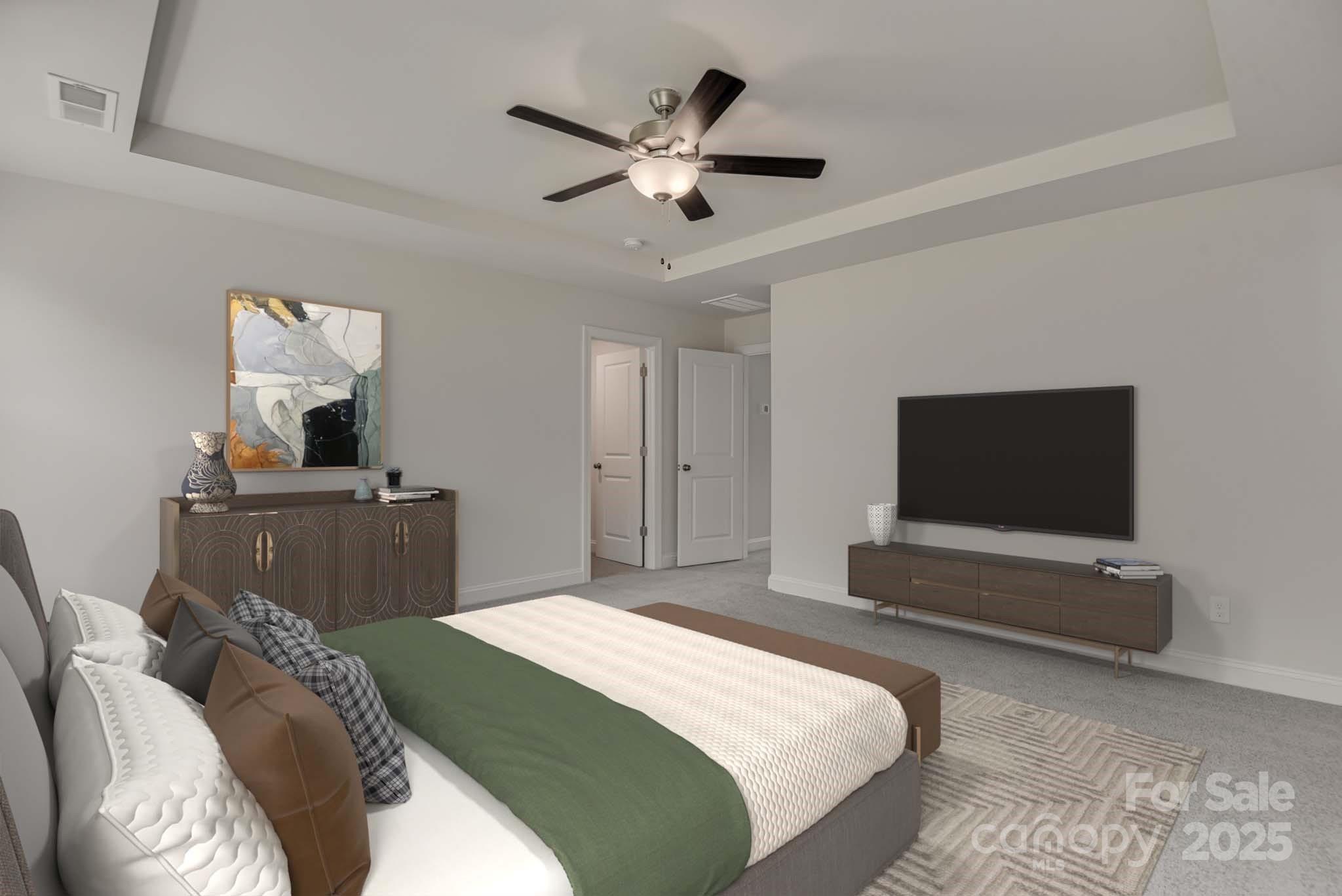 327 Alameda Way Matthews, NC 28104 - Photo 5 of 31 a bedroom with a bed and a flat screen tv