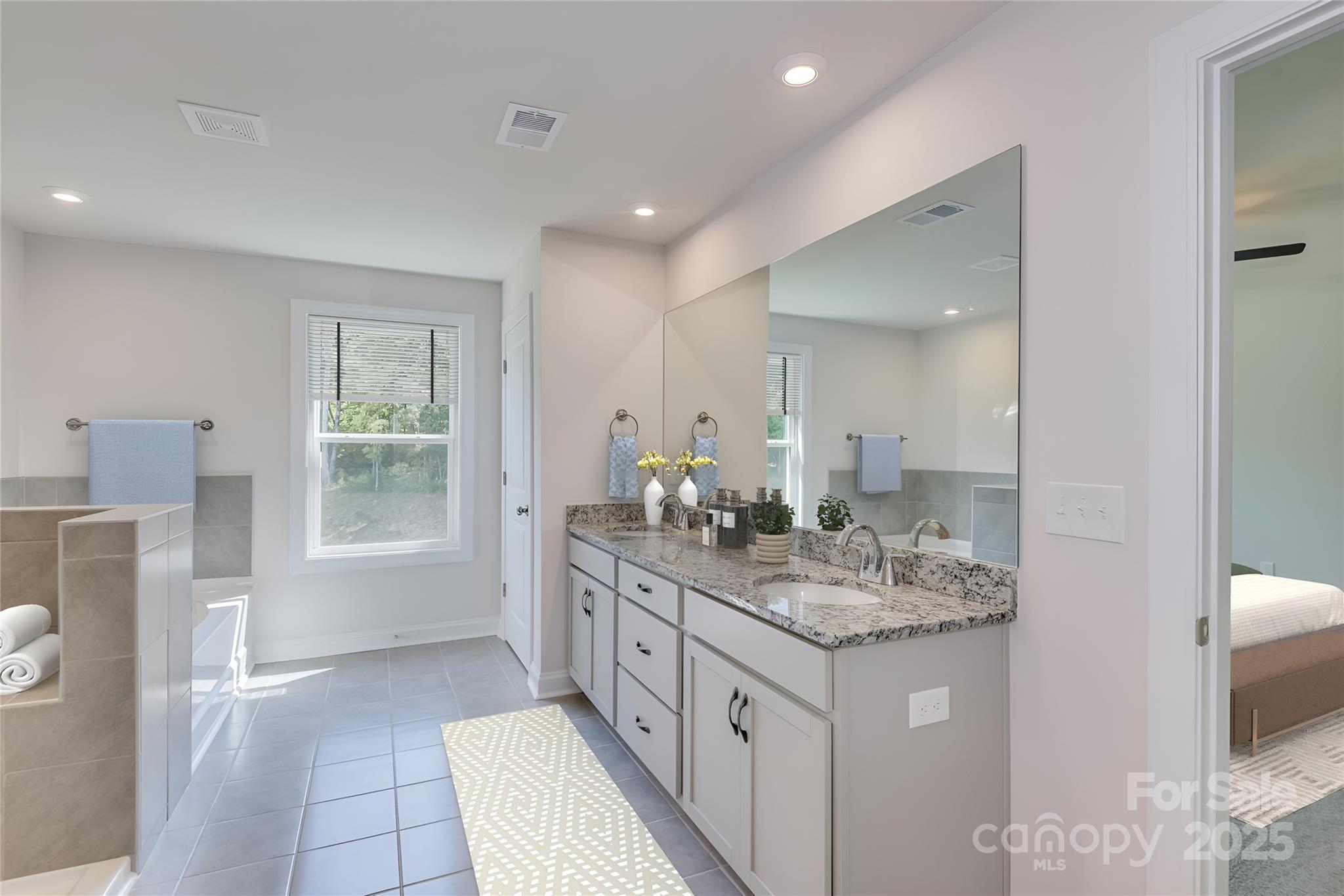 327 Alameda Way Matthews, NC 28104 - Photo 6 of 31 a bathroom with a sink a vanity and a mirror