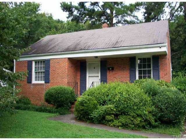 2105 Ann Street Raleigh, NC 27608 - Photo 1 of 1 a view of brick house with a yard plants and large tree