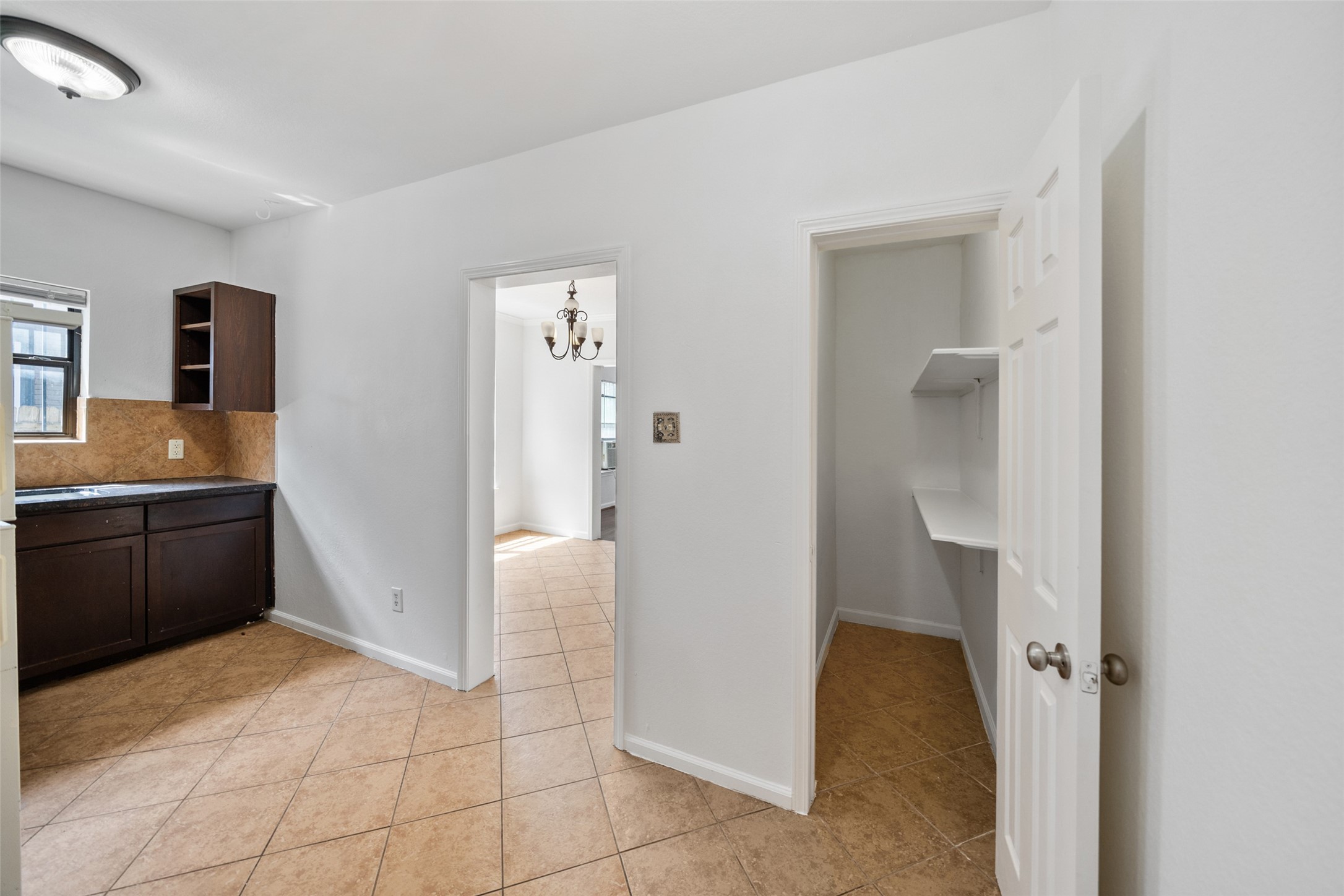 406 Quitman Street, Unit 2 Houston, TX 77009 - Photo 10 of 22 a spacious bathroom with a granite countertop sink a mirror and a refrigerator