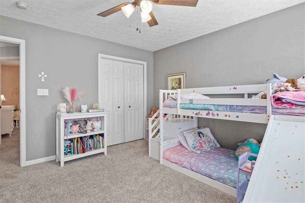 82 Diebold Road McKees Rocks, PA 15136 - Photo 19 of 30 a room with a baby bed a couch and dresser