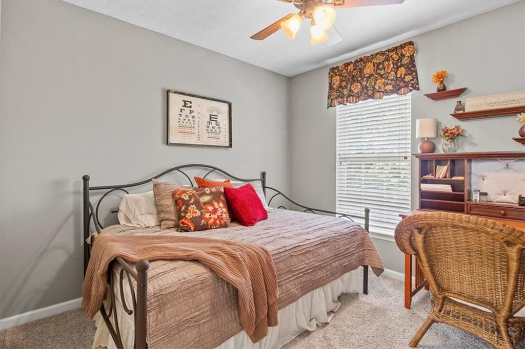 82 Diebold Road McKees Rocks, PA 15136 - Photo 21 of 30 a bedroom with a bed and a chandelier