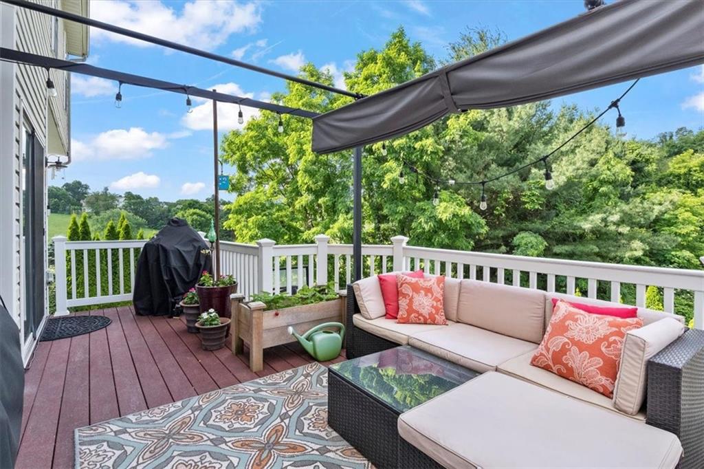 82 Diebold Road McKees Rocks, PA 15136 - Photo 26 of 30 a balcony with wooden floor and outdoor seating