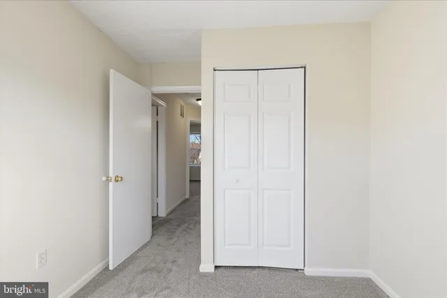 a bathroom with a sink mirror and toilet