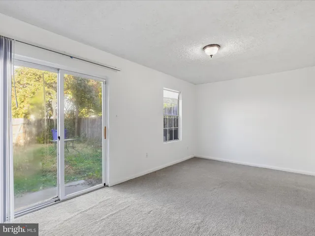 a picture of a bench in front of a wall