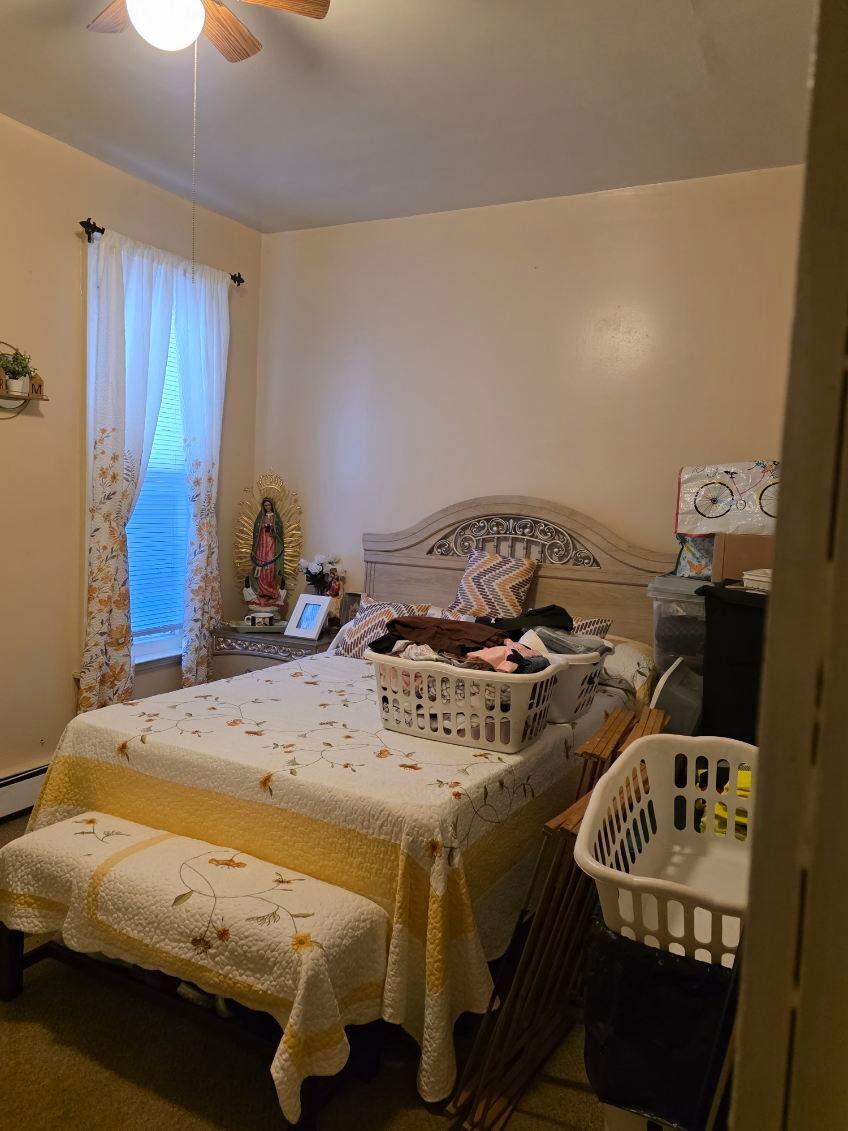 274 Park Street Bridgeport, CT 06608 - Photo 23 of 28 a bed sitting in a bedroom next to a window