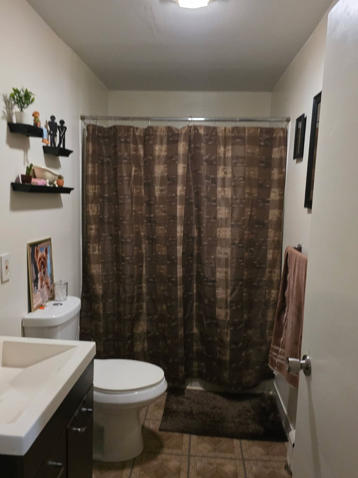 274 Park Street Bridgeport, CT 06608 - Photo 24 of 28 a bathroom with a shower curtain and a toilet