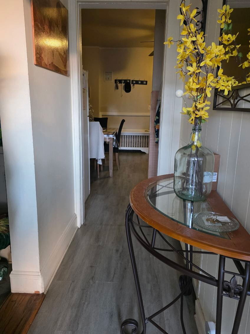274 Park Street Bridgeport, CT 06608 - Photo 28 of 28 a dining room with furniture and wooden floor