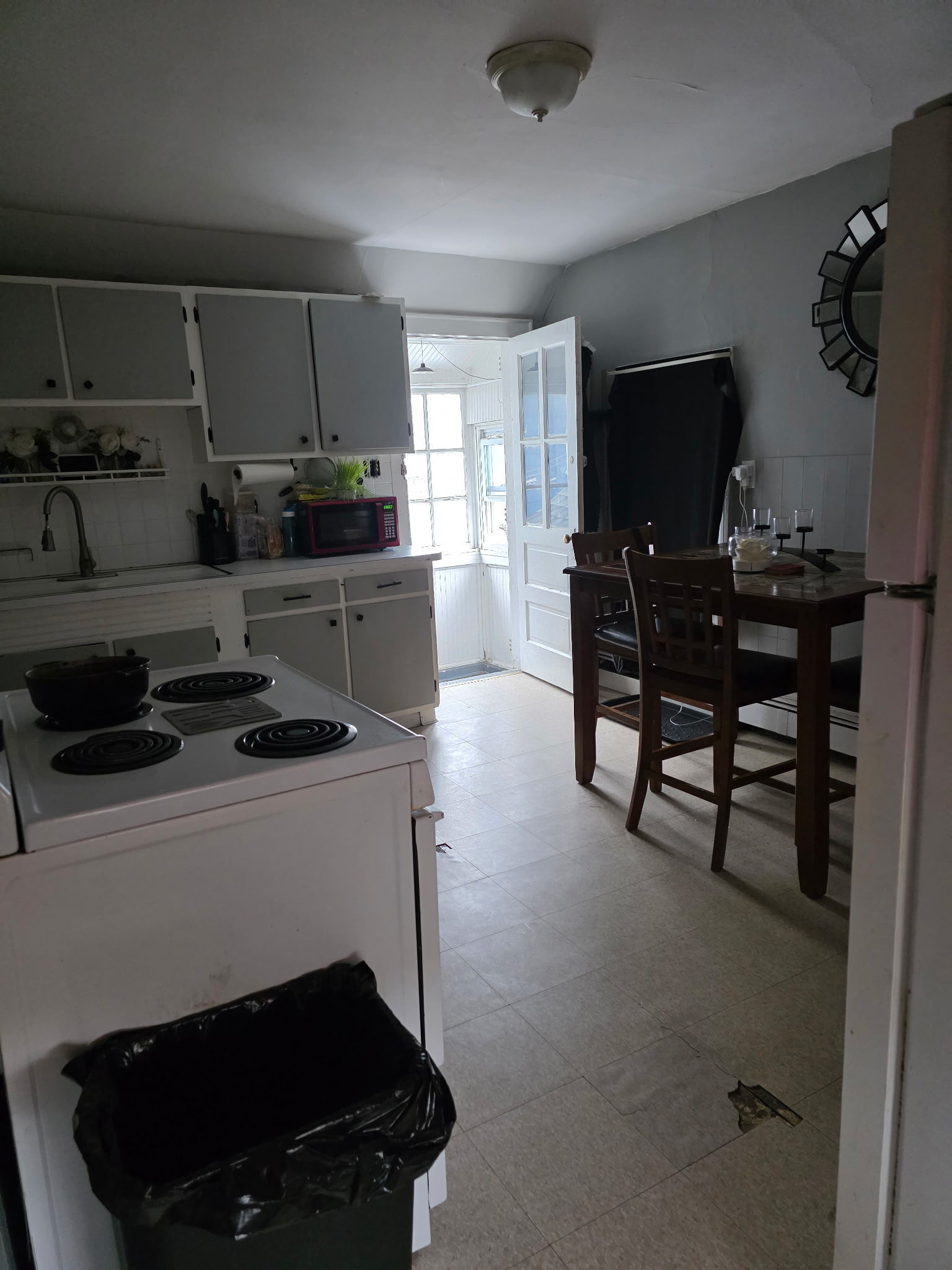 274 Park Street Bridgeport, CT 06608 - Photo 7 of 28 a kitchen with a table and chairs in it