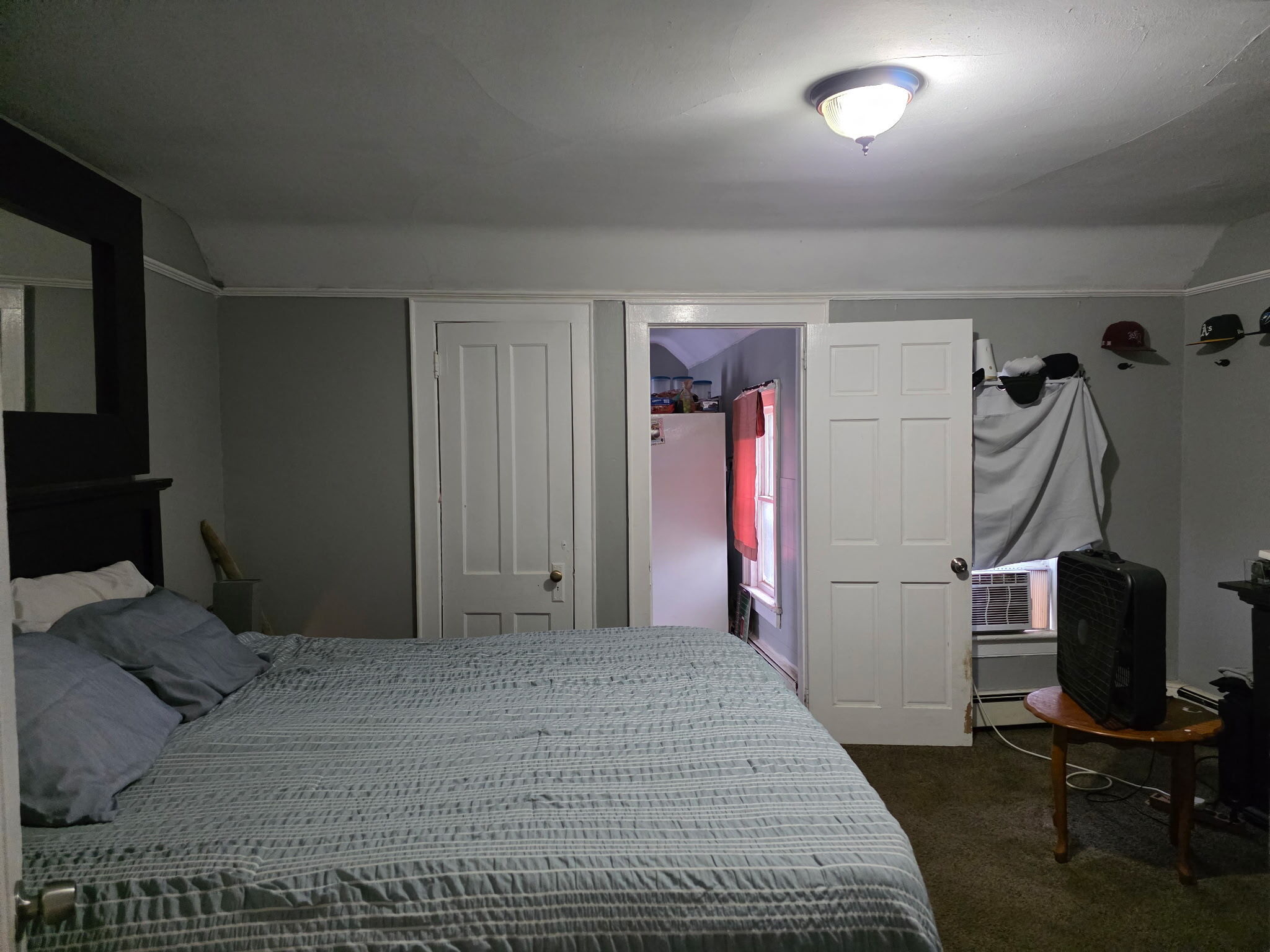 274 Park Street Bridgeport, CT 06608 - Photo 8 of 28 a bedroom with a bed and a chair