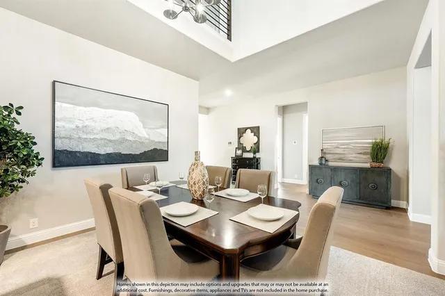 a dining room with furniture wooden floor and a rug