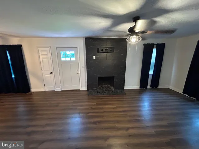 a view of a livingroom with wooden floor