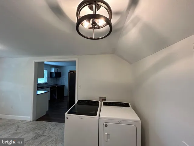 a room with a dryer and washer