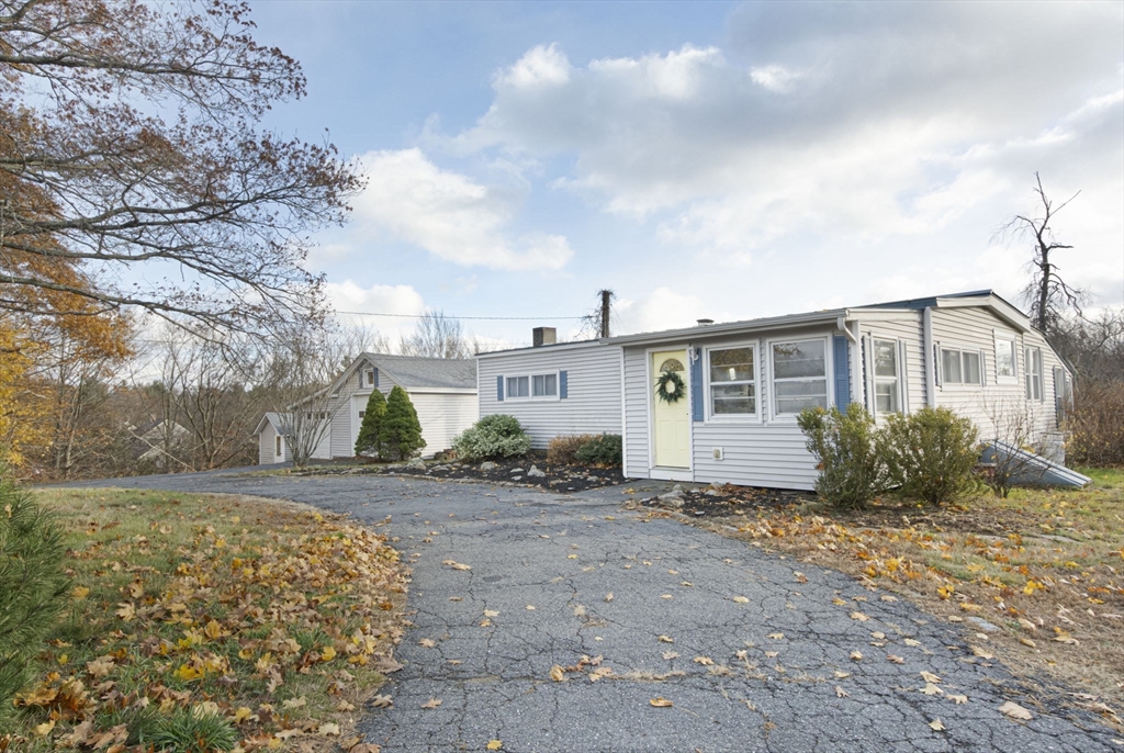 155 County Road Ashby, MA 01431 - Photo 2 of 38 a view of a house with a garden
