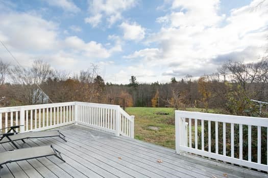 155 County Road Ashby, MA 01431 - Photo 34 of 38 a balcony with wooden floor and fence