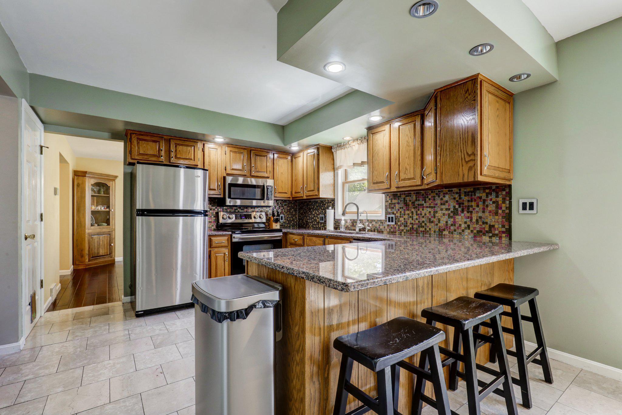 2 Mockingbird Drive Denver, PA 17517 - Photo 15 of 39 Modern kitchen with warm wood accents.