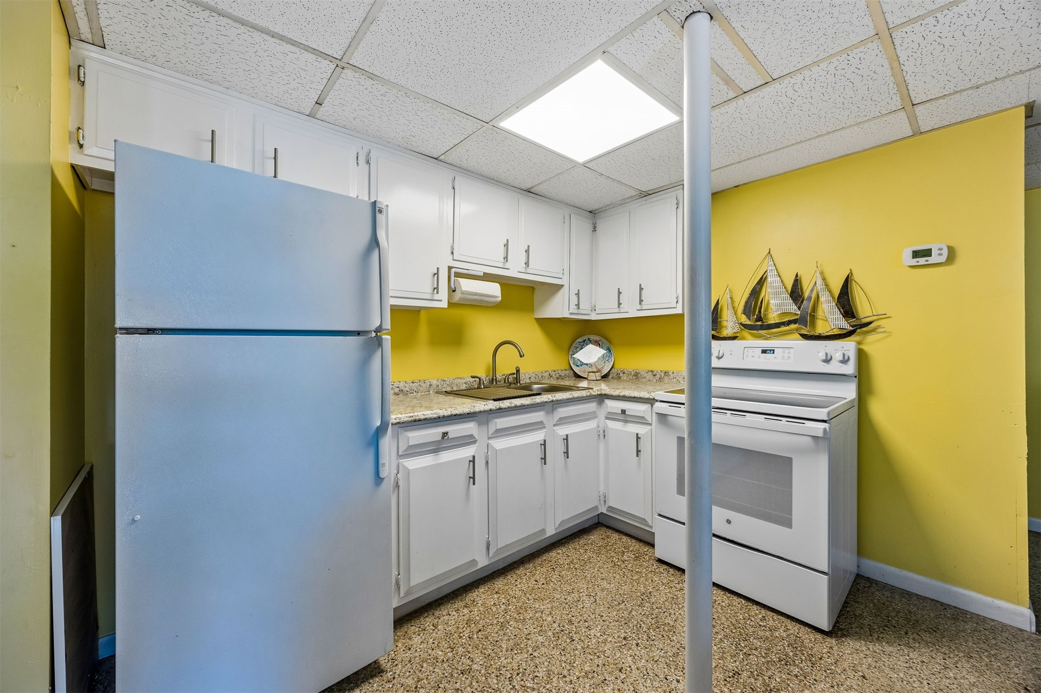 1990 South Fletcher Avenue Fernandina Beach, FL 32034 - Photo 40 of 47 a kitchen with a sink appliances and cabinets