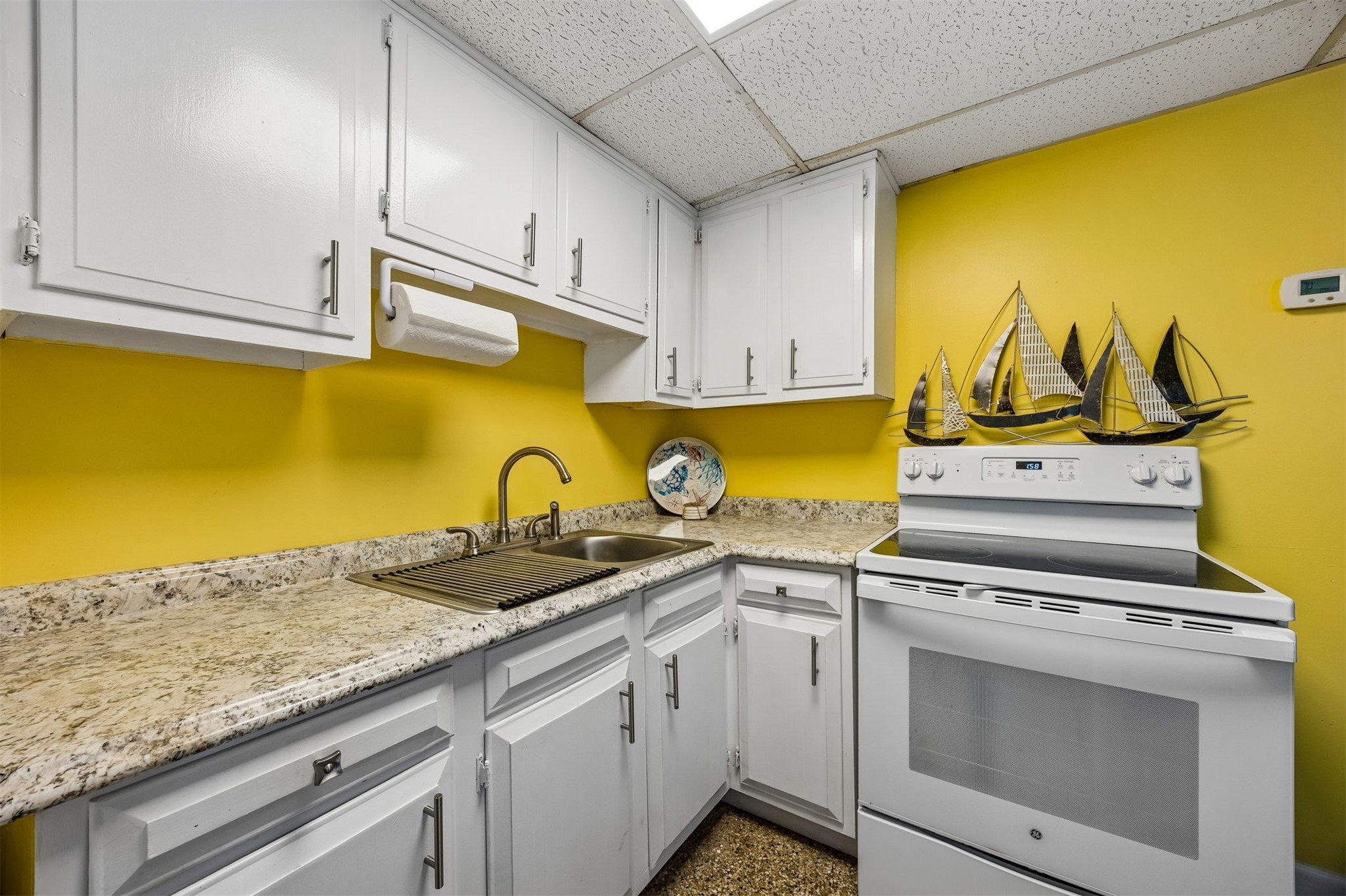 1990 South Fletcher Avenue Fernandina Beach, FL 32034 - Photo 41 of 47 a kitchen with granite countertop cabinets stainless steel appliances and a counter space