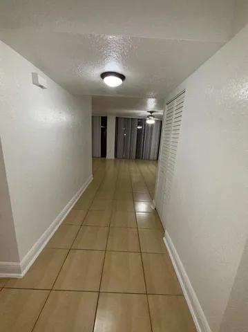 a view of hallway with a window