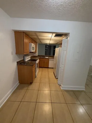 a view of a storage & utility room with a sink