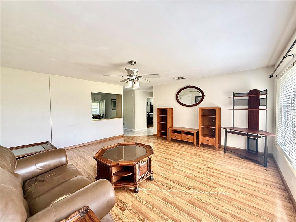 210 14th Avenue Southwest Largo, FL 33770 - Photo 2 of 8 a living room with furniture and a wooden floor