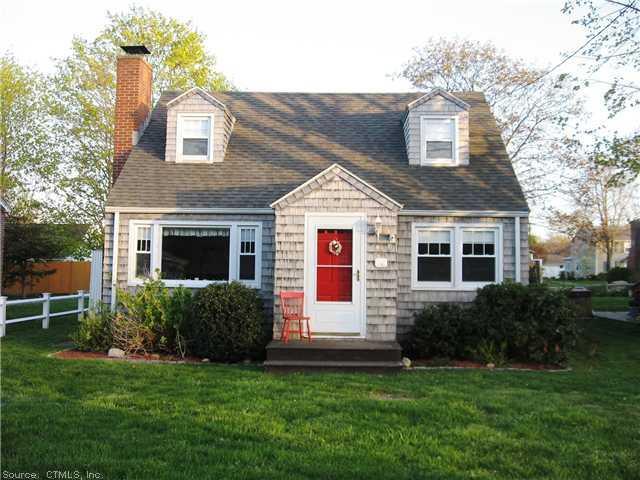 46 Whitecap Road East Lyme, CT 06357 - Photo 1 of 1 a front view of a house with a garden and yard