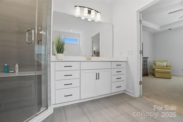 a bathroom with a double vanity sink and a mirror