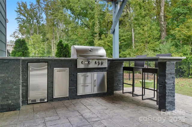 a view of a porch with furniture and garden